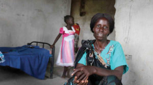 eliza-with-her-daughter-in-the-background-credit-stella-madete-oxfam.jpg