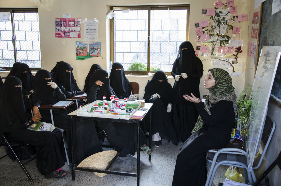 Women in Yemen sitting around table