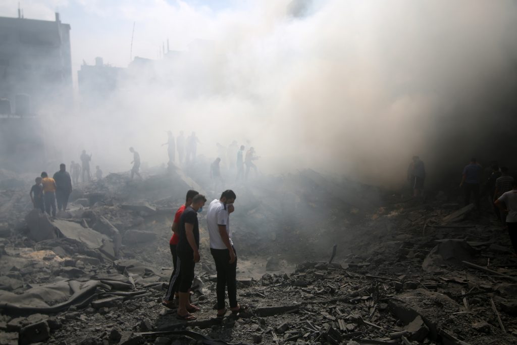 Palestinians look for survivors after an Israeli airstrike in Rafah refugee camp, southern Gaza Strip, on October 12 2023.