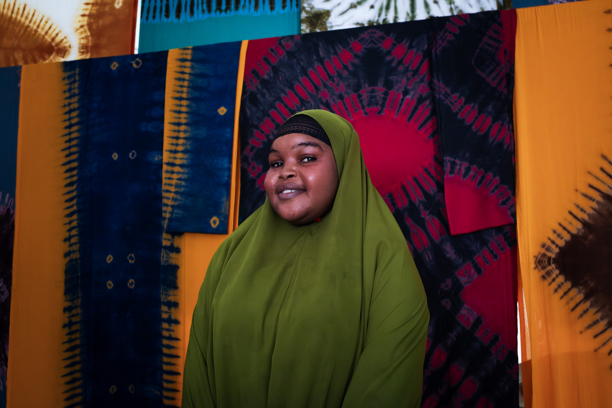 Fardouza is taking part in a tie-dye workshop. Photo: Caroline Leal/Oxfam